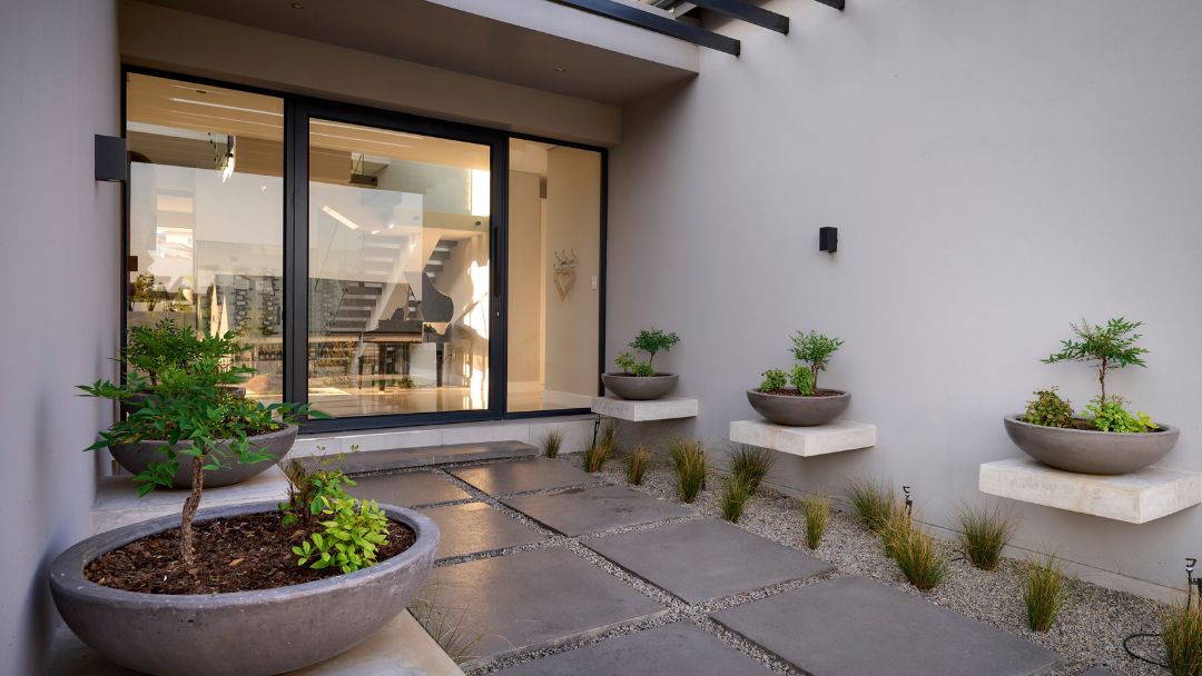 creative-stone-entrance-paving Simulated stone flamed granite flagstone paving and coping used for built-in outdoor firepit area